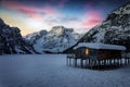 A purple sky over the frozen Lago di Braies, or Pragser Wildsee Royalty Free Stock Photo