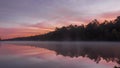 Fog settles on Lake Dow during sunrise in McDonough, GA.