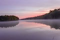 Fog settles on Lake Dow during sunrise in McDonough, GA.