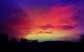 Purple sky sunset background wallpaper. Purple red orange yellow sky background with clouds sunset or sunrise Royalty Free Stock Photo