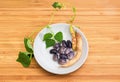 Purple speckled kidney beans with stem and pods on saucer