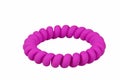 Purple spiral rubber bands for hair on a white background.