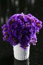 Purple Statice flowers in white jar