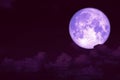 purple strawberry moon back on silhouette heap cloud on sunset sky Royalty Free Stock Photo