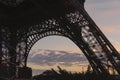 Purple sunset behind base of Eiffel Tower