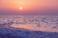 Purple sunset over sea beach Royalty Free Stock Photo