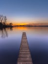 Purple Sunset over Serene Lake vertical Royalty Free Stock Photo