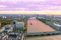 Purple sunset scenery of London city United Kingdom - Thames river, Westminster bridge and Houses of Parliament Royalty Free Stock Photo