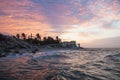 Purple sunset with waves along the coast of Chelem, Mexico Royalty Free Stock Photo