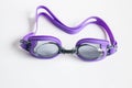 Purple swim goggles on white background Royalty Free Stock Photo