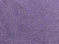 Purple texture of the soft rubber surface of the safe cover of the sports playground for workout made of pressed fine rubber. The