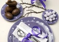 Purple theme Easter dinner, breakfast or brunch table setting, aerial view. Royalty Free Stock Photo