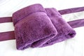 Purple towels on the bed rooms