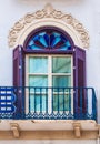 Purple traditional window in Spain wit stucco decoration Royalty Free Stock Photo
