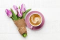 Purple tulip flowers bouquet and coffee cup Royalty Free Stock Photo