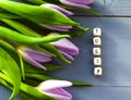 Purple tulips blossom inscription macro green spring mothers day nature decoration bouquet bright wood