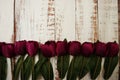 Purple Tulips bouquet with Space for text on a wooden background