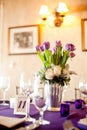 Purple tulips centerpiece at a formal dinner