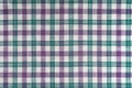 Purple and turquoise checkered texture fabric, tartan pattern background. Royalty Free Stock Photo