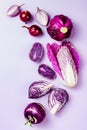 Purple vegetables on pastel color background. Minimal concept. Plant based vegan or vegetarian cooking. Clean eating food