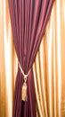 Purple velvet courtain with tassel Royalty Free Stock Photo