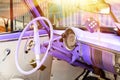 Purple vintage classic interior of American car parked on the street of Old Havana, Cuba Royalty Free Stock Photo