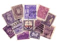 Purple vintage postage stamps from around the world.
