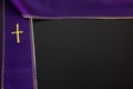 Purple violet priest`s stole on a black background