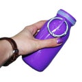 Purple violet Silicone bottle in the female hand