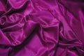 Purple violet silk fabric background, texture. Luxury wavy satin textile for backdrop