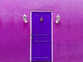 purple wall with a purple door Royalty Free Stock Photo