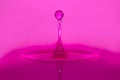 Purple water drop splash Royalty Free Stock Photo