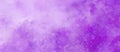 Purple watercolor background texture with white abstract painted clouds in sky with bokeh lights or paint spatter