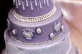 Purple wedding cake decorated with flowers Royalty Free Stock Photo