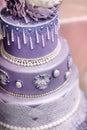 Purple wedding cake decorated with flowers Royalty Free Stock Photo