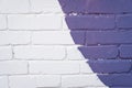 Purple and white brick wall texture background. Street art detail on house exterior. Brush strokes. Old, painted, weathered bricks Royalty Free Stock Photo