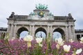 Flowers in front of Triumphal Arch in Cinquantenaire Parc in Brussels, Belgium