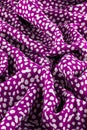 Purple and white polka dot fabric