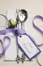 Purple and white shabby chic wedding table setting. Vertical. Royalty Free Stock Photo