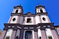 purple and white stucco church elevation and towers in perspective view in Szekesfehervar Royalty Free Stock Photo