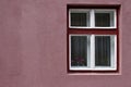 Purple window frame on pink wall Royalty Free Stock Photo