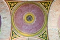 Purple and yellow domed vault ceiling with ornament in portal entry of Church of Three Saints bottom view. University of Chernivts