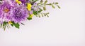 Purple and yellow flowers corner arrangement Royalty Free Stock Photo