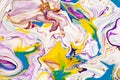 Purple and yellow vibrant abstract marbled texture. Vibrant, colorful, liquid, fluid art background.