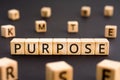 Purpose - word from wooden blocks with letters