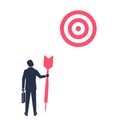 Purposeful businessman with spear in hand looks at target