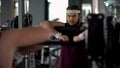 Purposeful chubby man posing at mirror as strong athlete, workout motivation