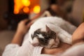 A purrfect evening - woman relaxing with her kitten