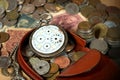 Purse with Broken Pocket Watch and Coins Royalty Free Stock Photo