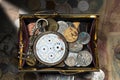 Purse with Broken Pocket Watch and Coins Royalty Free Stock Photo